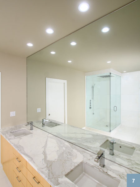 Minimal bathroom with large mirror
