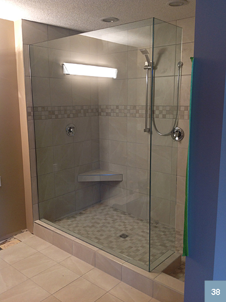 Glass-sided shower with small, corner seat