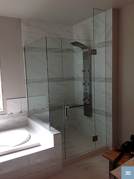 Glass-sided shower with massager